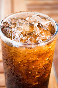 Close up ice cubes on cola glass