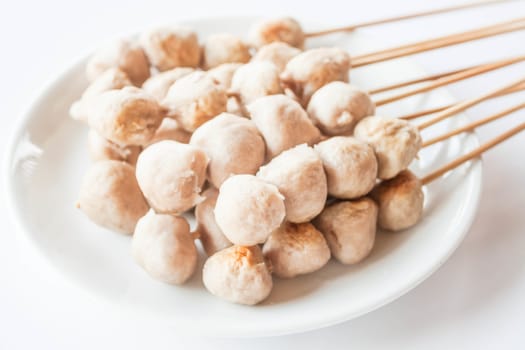 Mini pork balls in white plate on clean table