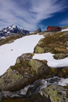 Picturesque norwegian mountain cabin on Lofoten islands in Norway during summer