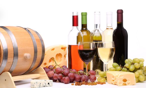 bottles and glasses of wine, assortment of grapes and cheese