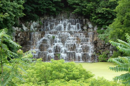 A waterfall on a pond