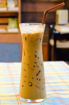 ice coffee  with  drinking straw on table