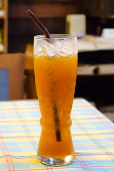 ice tea  with drinking straw on the table , 