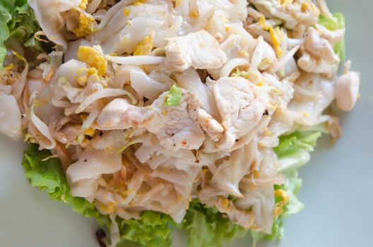 Top view Fried Noodles  with chicken , egg and vegetable on plate