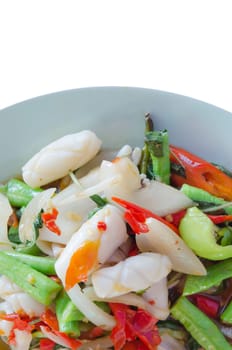 squid  fried with chili pepper ,  mix vegetable on dish over white background