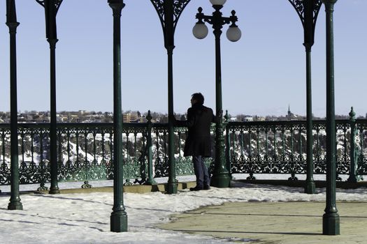 Man reflecting at an overlook observation deck