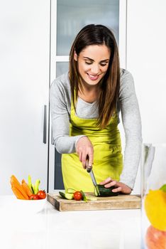 Young Woman Cooking. Healthy Food - Vegetable Salad. Diet. Dieting Concept. Healthy Lifestyle. Cooking At Home. Prepare Food 