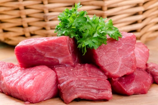 Fresh raw meat on wooden board.