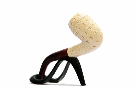 Souvenir Tobacco pipe on a stand on a white background