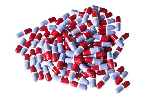 Heap of red and blue pills isolated on a white background