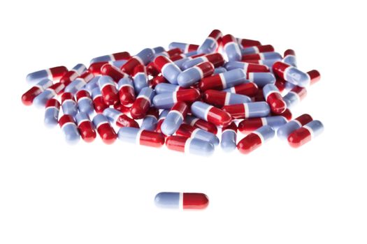 Heap of red and blue pills isolated on a white background