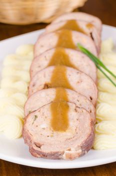 Beef roulade served with a butter garnish
