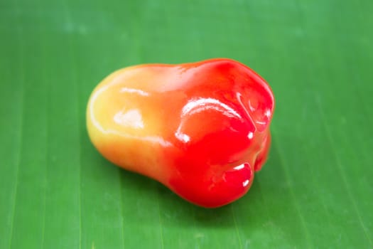 rose apple lookchoob thai dessert on banana leaf,lookchoob is thai dessert included greenbean, sugar and jelly.