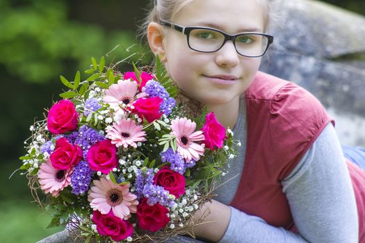portrait of a beautiful young girl with flowers 