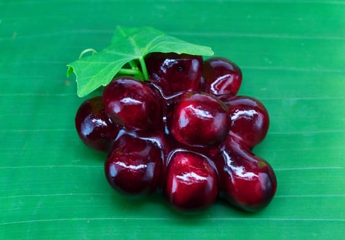 grape lookchoob thai dessert on banana leaf, lookchoob is thai dessert included greenbean, sugar and jelly.