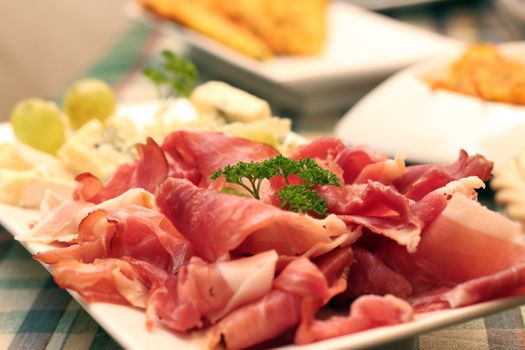 slices of fresh bacon served on white plate