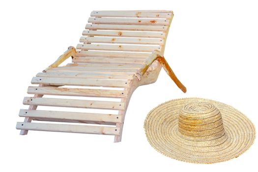 beach items for relaxation in the sun - wooden chair and sombrero