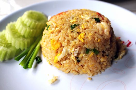 Snack rice with fried egg and cucumber