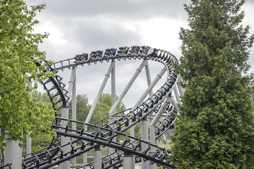 BIDDINGHUIZEN,HOLLAN D - MAY 20:Unidentified people having fun in the rollarcoaster on May 25,2013 in Biddinghuizen, Holland. This amusement park is the biggest rollarcoasterpark in Holland