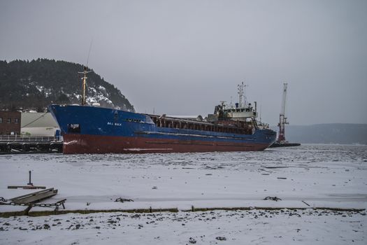The ship Bal Bulk, Flag: Faroe Island  is a Cargo ship which transports dry cargo. The picture is shot in snowfall one day in February 2013, at the port of Halden, Norway. 