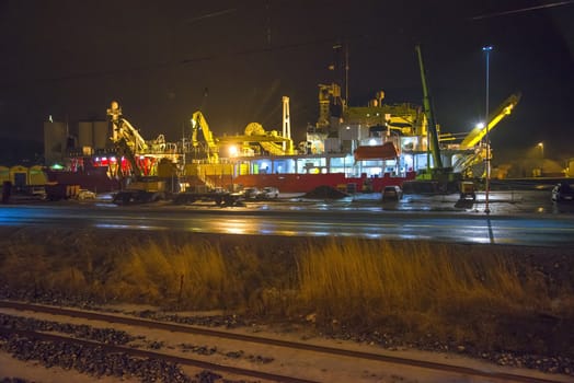 Nexans Skagerrak, which is an submarine cable laying vessel is moored to the quay at Halden, Norway harbor. The picture is shot one night in January 2013.