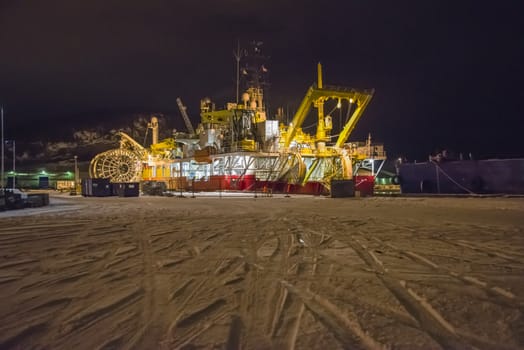 Nexans Skagerrak, which is an submarine cable laying vessel is moored to the quay at Halden, Norway harbor. The picture is shot one night in February 2013.