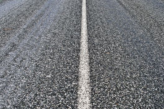 Close up of gray asphalt road