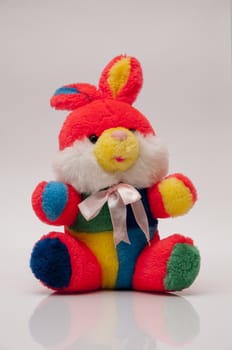 teddy bear of many colors and with a bow