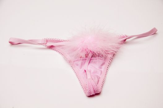 pink thong with a pompon behind