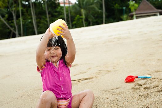 Young toddler at the beach having fun and is curios