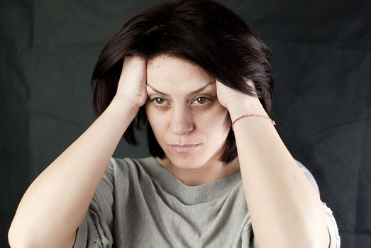 conceptual portrait of stressed abused young woman 