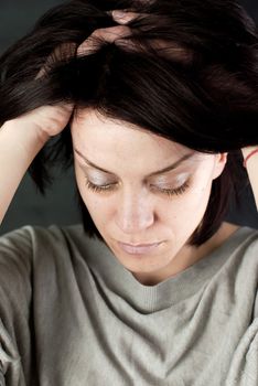 conceptual portrait of stressed abused young woman 