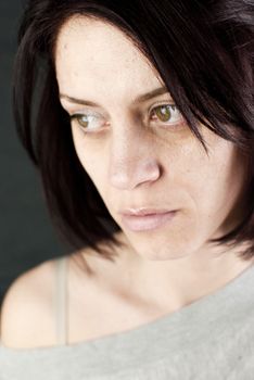 conceptual portrait of stressed abused young woman 