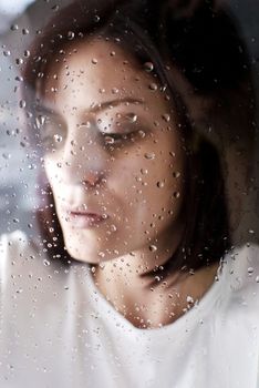 conceptual portrait of stressed abused young woman 