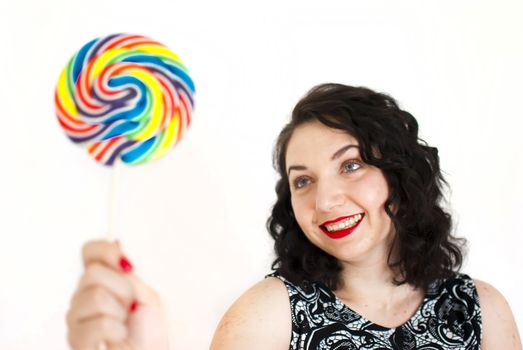 beautiful retro girls portrait with colorful lollipop