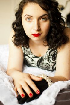 sansual retro girl portrait lying on a bed