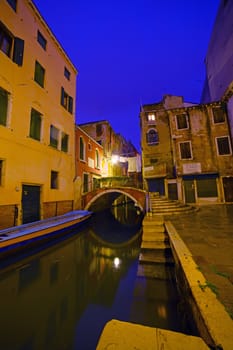 View of a street in venice in the night, Venice, Italy. Vertical view