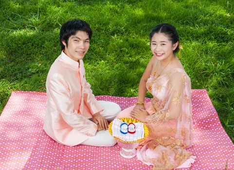Asian Thai bridal in Thai wedding suit with wedding rings.