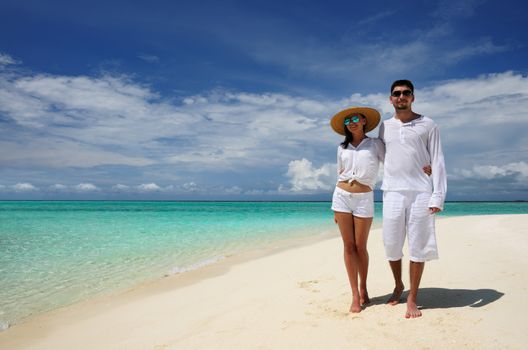 Couple on a tropical beach at Maldives