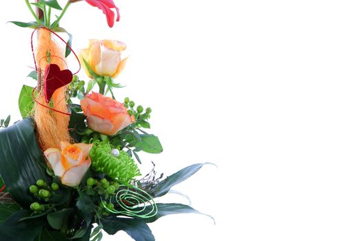 Beautiful wedding flower arrangement with roses greenery and berries together with a wire spiral and red heart