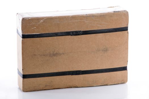 Strapped rectangular cardboard box ready for mail or courier delivery of an ordered product