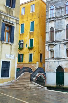 Beautiful romantic Venetian scenery. Street, canal, bridge. Venice. Italy