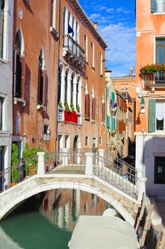 Beautiful romantic Venetian scenery. Street, canal, bridge. Venice. Italy