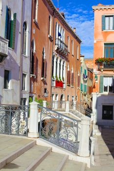 Beautiful romantic Venetian scenery. Street, canal, bridge. Venice. Italy