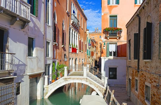 Beautiful romantic Venetian scenery. Street, canal, bridge. Venice. Italy