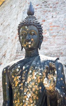 black Buddha statue in the temple