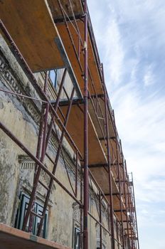 Scaffold surrounding old house during renovation works.