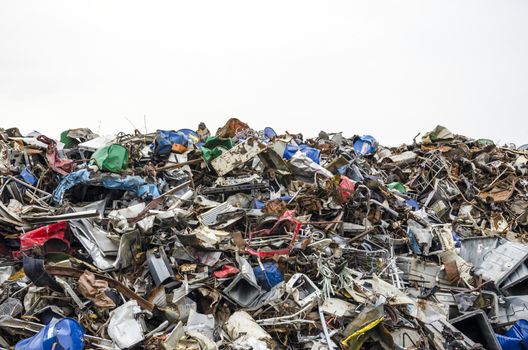 Pile of metal waste isolated on white background.