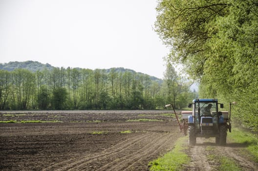 Farmer checking mechanization before planting corn seeds.