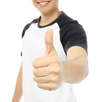 A smiling teenager doing a thumbs up hand sign